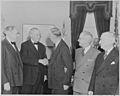 Photograph of George C. Marshall shaking hands with Senator Tom Connally of Texas, as Senator Arthur Vandenberg of... - NARA - 199518