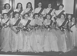 StateLibQld 1 296739 Debutantes holding bouquets at a social dance, 1952