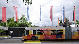 TOSA Bus at PALEXPO with flag