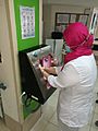 A nurse uses a smart hand washing device