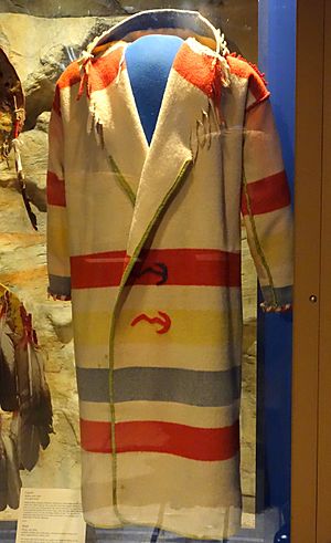 Capote for scout on raiding party, Siksika, early 1900s, wool from Hudson's Bay Company blanket, glass beads - Glenbow Museum - DSC01002