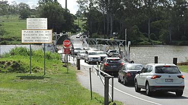 Cars disembarking into Moggill from the Moggill ferry while other cars wait to board, 2021 01.jpg