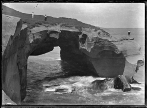 Rock arch forming a natural bridge at Tunnel Beach, ca 2 km west of St Clair, Dunedin. ATLIB 273680