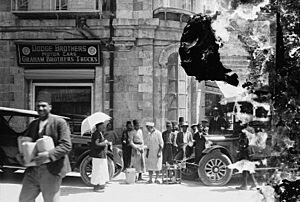 Street scene looking toward store front of Dodge Brothers Motor Cars-Graham Brothers Trucks LOC matpc.08816 (cropped)