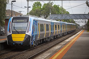 A high capacity metro train at a station in Melbourne