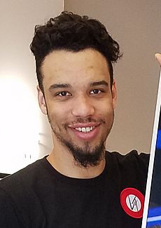Dillion Brooks with picture for his Apartment (cropped)