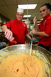 Flickr - Official U.S. Navy Imagery - Chef Robert Irvine helps Sailors cook.