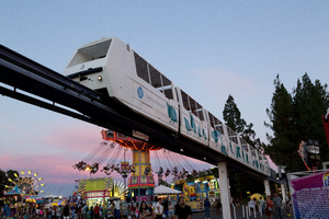 Monorail and rides at dusk at the 2012 California State Fair held in Sacramento, California LCCN2013633011