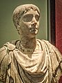 Portrait of a young man with hairstyle, facial features and long neck pointing to portraits made in the early 100s CE MH