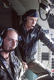 General Merrill McPeak observes operations in the cockpit of C-130 Hercules