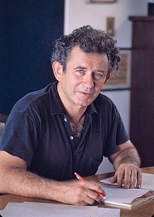 Norman Mailer writing, cropped