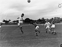 StateLibQld 1 83579 Queensland plays New South Wales in a soccer match at The 'Gabba, 1950