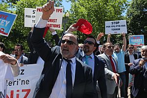 Supporters of Turkish President Recep Tayyip Erdogan react to anti-Erdogan supporters outside the White House in Washington 01