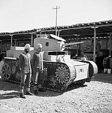 Two Sikh members of an Indian camouflage unit in Baghdad, with a dummy Stuart tank mounted on a car chassis, 25 March 1942. E9697