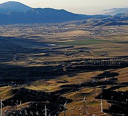 View of wind turbines with Tehachapi in the distance