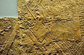 Relief depicting an Assyrian siege engine attacking the city wall of Lachish