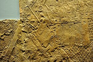 Assyrian siege-engine attacking the city wall of Lachish, part of the ascending assaulting wave. Detail of a wall relief dating back to the reign of Sennacherib, 700-692 BCE. From Nineveh, Iraq, currently housed in the British Museum