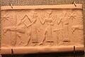 Oriental Institute Museum. God with ax attacks eagle while Shamash and Worshipper stand behind (5948336437)