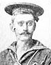Head of a white man with handlebar mustache wearing a sailor suit and a flat cap.