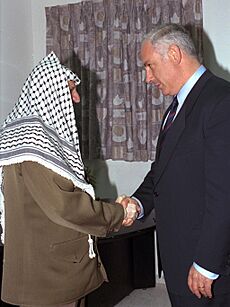 P.M. BENJAMIN NETANYAHU SHAKING HANDS WITH PALESTINIAN AUTHORITY CHAIRMAN YASSER ARAFAT (3x4 cropped)