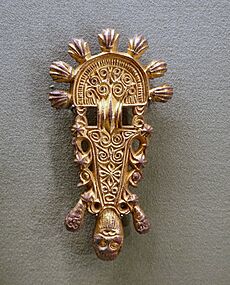 Pair of radiate-head bow brooches, Slavic, 2 of 2, c. 600-650 AD, copper alloy, gilding - Morgan Library & Museum - New York City - DSC06620