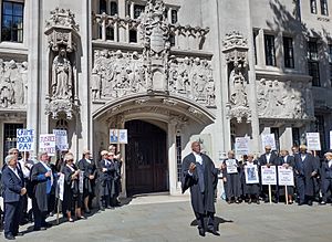 Shaun Wallace addresses the rally supporting barristers' industrial action outside the Supreme Court, London, 11 July 2022
