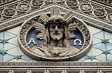 St. Aloysius Catholic Church sculptural detail above circular window