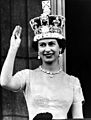 Elizabeth II waves from the palace balcony after the Coronation, 1953