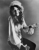 Janis Joplin seated 1970