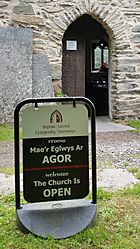 The Sacred Doorways sign outside a church