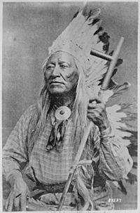 Washakie (Shoots-the-Buffalo-Running), a Shoshoni chief, half-length, seated, holding pipe - NARA - 530875.jpg
