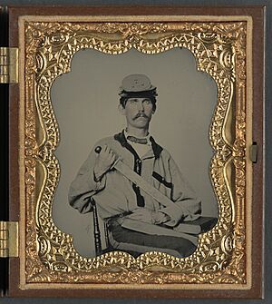(Unidentified soldier in Confederate uniform and Co. D, 3rd North Carolina Volunteers Regiment hat with Bowie knife and sheath with initials J.L.W.) (LOC) (14378946990)