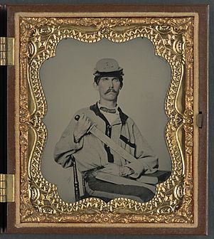 (Unidentified soldier in Confederate uniform and Co. D, 3rd North Carolina Volunteers Regiment hat with Bowie knife and sheath with initials J.L.W.) (LOC) (14378946990)