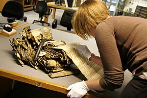 A researcher working with delicate resource at The National Archives