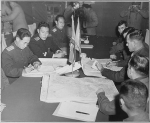 Colonel James Murray, Jr., USMC, and Colonel Chang Chun San, of the North Korean Communist Army, initial maps showing... - NARA - 520806