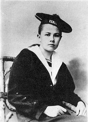 Androgynous photograph of Eberhardt as a teenager in a short haircut and a sailor's uniform