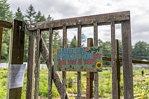 Sign on a gate to the community farm space at the Evergreen State College Organic Farm during mid June of 2019