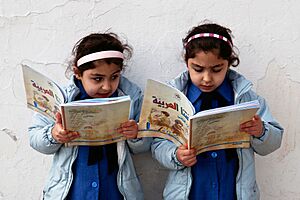Young girls reading - Government primary school in Amman, Jordan