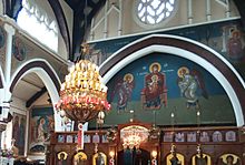 Altar iconostasis and mural painting of Theotokos inside Virgin Mary Eleousa church in Nottingham