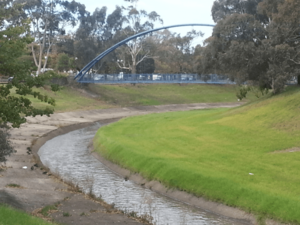 Dandenong creek and pedestrian bridge at Dandenong Park