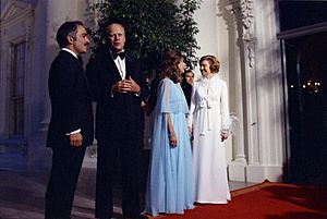 King Hussein of Jordan, President Gerald R. Ford, First Lady Betty Ford, and Queen Alia Standing in the North Portico of the White House Prior to a State Dinner - NARA - 23869121