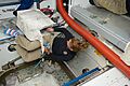 STS-135 Sandy Magnus with a cargo transfer bag