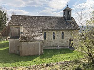 A small Cotswold stone church with small bell turret
