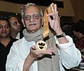 The veteran film lyricist, director, screen writer, producer and poet, Shri Gulzar with the Dadasaheb Phalke Award 2013, presented by the President, Shri Pranab Mukherjee, at the 61st National Film Awards function
