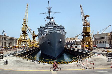 US Navy 030715-N-0111R-001 A Maltese shipyard worker heads home on his bicycle after a day's work on USS La Salle (AFS 3)