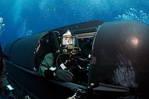 US Navy 050505-N-3093M-003 A member of SEAL Delivery Vehicle Team Two (SDVT-2) prepares to launch one of the team's SEAL Delivery Vehicles (SDV) from the back of the Los Angeles-class attack submarine USS Philadelphia (SSN 690)