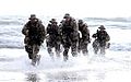A Seal Team is coming out of water