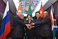BRICS heads of state and government hold hands ahead of the 2014 G-20 summit in Brisbane, Australia