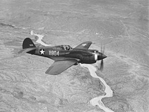 Curtiss P-40, ¾-front view, in flight (00910460 023)