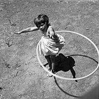 Girl twirling Hula Hoop, 1958.jpg